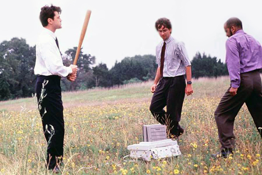 Three main characters in the fax machine scene from the film Office Space